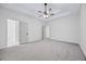 Main bedroom with carpet flooring and trey ceiling at 1965 Tiner Ct, Cumming, GA 30041