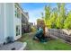 Inviting backyard with a playset, fenced yard, and lush green lawn at 2208 Sage Mountain Sw Ct, Marietta, GA 30064