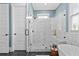 Bathroom featuring a tiled shower with a glass door, a soaking tub, and modern fixtures at 2208 Sage Mountain Sw Ct, Marietta, GA 30064