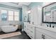 Bathroom featuring double vanity, freestanding tub and modern fixtures at 2208 Sage Mountain Sw Ct, Marietta, GA 30064