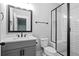 Modern bathroom features a walk-in shower with white subway tile and dark fixtures at 2208 Sage Mountain Sw Ct, Marietta, GA 30064