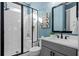 Modern bathroom featuring a walk-in shower with glass enclosure and sleek vanity at 2208 Sage Mountain Sw Ct, Marietta, GA 30064