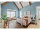 Bedroom featuring wooden beams, hardwood floors, and plenty of natural light at 2208 Sage Mountain Sw Ct, Marietta, GA 30064