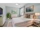 Comfortable bedroom featuring a queen-sized bed, elegant decor, and natural light at 2208 Sage Mountain Sw Ct, Marietta, GA 30064