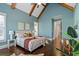 Spacious bedroom with vaulted ceilings, wooden beams, and hardwood floors at 2208 Sage Mountain Sw Ct, Marietta, GA 30064