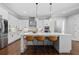 Bright kitchen with stainless steel appliances, pendant lighting, and an island with seating at 2208 Sage Mountain Sw Ct, Marietta, GA 30064
