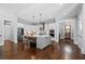 Gourmet kitchen with stainless steel appliances, a large island, modern lighting, and hardwood floors at 2208 Sage Mountain Sw Ct, Marietta, GA 30064