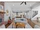 Bright, open-concept layout with brick fireplace, kitchen island, and staircase visible from the living room at 2208 Sage Mountain Sw Ct, Marietta, GA 30064