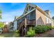 Charming screened porch with a wood-burning fireplace and stunning views of the property at 2208 Sage Mountain Sw Ct, Marietta, GA 30064