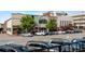 Charming city street with a mix of shops, restaurants, and parked cars on a sunny day at 2208 Sage Mountain Sw Ct, Marietta, GA 30064