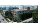 Aerial view of loft style condominiums with skyline in the background at 890 Memorial Se Dr # 102, Atlanta, GA 30316