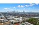 This aerial view captures the city skyline, highlighting the location of the property, surrounded by lush greenery at 890 Memorial Se Dr # 102, Atlanta, GA 30316