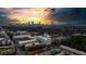 Stunning aerial view of the city skyline at sunset, showcasing the property's prime location and picturesque surroundings at 890 Memorial Se Dr # 102, Atlanta, GA 30316