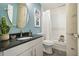 Bathroom with a vanity, round mirror, and bathtub-shower combo, perfect for relaxing after a long day at 890 Memorial Se Dr # 102, Atlanta, GA 30316