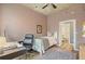 Bedroom featuring hardwood floors, a desk, and easy access to a bathroom with a tub-shower combo at 890 Memorial Se Dr # 102, Atlanta, GA 30316