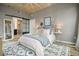 Comfortable bedroom showcases a plush bed, modern decor, ensuite bathroom with a glass shower and sliding door at 890 Memorial Se Dr # 102, Atlanta, GA 30316