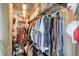 Walk-in closet with ample storage and hanging space with exposed ceiling and storage shelving at 890 Memorial Se Dr # 102, Atlanta, GA 30316