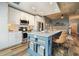 Modern kitchen featuring white cabinets, stainless steel appliances, a large island, and an open concept design at 890 Memorial Se Dr # 102, Atlanta, GA 30316