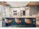A modern kitchen featuring white cabinets, stainless steel appliances, and a large island with counter seating at 890 Memorial Se Dr # 102, Atlanta, GA 30316