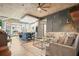 Open-concept living room featuring concrete ceilings, kitchen island, comfortable seating, and stylish decor at 890 Memorial Se Dr # 102, Atlanta, GA 30316