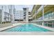 Inviting community pool with well-maintained deck surrounded by modern condo buildings at 890 Memorial Se Dr # 102, Atlanta, GA 30316