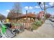 Charming outdoor restaurant with scooter parking, wooden pergola, and pedestrian traffic at 890 Memorial Se Dr # 102, Atlanta, GA 30316