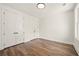 Spacious bedroom with hardwood floors, white walls, and double closets at 2200 Carlton Ct # 6, Atlanta, GA 30318