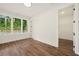 Bright bedroom with hardwood floors and a large window overlooking greenery at 2200 Carlton Ct # 6, Atlanta, GA 30318