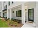 Beautiful white painted brick exterior with black trimmed windows and modern design elements at 2200 Carlton Ct # 6, Atlanta, GA 30318