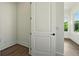 Bright hallway area featuring hardwood floors, white walls, and large windows allowing for ample natural light at 2200 Carlton Ct # 6, Atlanta, GA 30318
