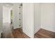 Hallway featuring hardwood floors, white trim, and doorways leading to other rooms at 2200 Carlton Ct # 6, Atlanta, GA 30318
