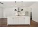 Spacious kitchen island with quartz countertop, stainless steel faucet, and white cabinets at 2200 Carlton Ct # 6, Atlanta, GA 30318