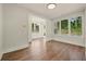Bright living room with hardwood floors, white trim, and large windows offering a view at 2200 Carlton Ct # 6, Atlanta, GA 30318