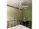 Bedroom with a ceiling fan, built-in wardrobe, desk and green walls at 2477 N Decatur Rd # A1, Decatur, GA 30033