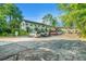 Exterior view of building featuring green landscaping, ample parking, and a courtyard setting at 2477 N Decatur Rd # A1, Decatur, GA 30033