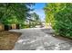 Exterior view of townhomes with parking spots and trees, and long driveway at 2477 N Decatur Rd # A1, Decatur, GA 30033