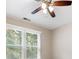 Bedroom featuring a ceiling fan and a window with blinds at 7035 Hampton Bluff Way, Roswell, GA 30075