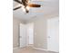 Bedroom with three doors and neutral paint and carpet at 7035 Hampton Bluff Way, Roswell, GA 30075
