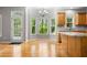 Bright kitchen with stainless steel appliances, granite counters, an island, and access to a large deck for outdoor entertaining at 7035 Hampton Bluff Way, Roswell, GA 30075