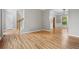 Bright and airy living room featuring gleaming hardwood floors and fresh paint, creating a welcoming atmosphere at 7035 Hampton Bluff Way, Roswell, GA 30075