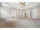 Spacious main bedroom with recessed lighting, tray ceiling, and neutral carpeting at 7035 Hampton Bluff Way, Roswell, GA 30075