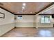 Open finished basement with recessed lighting, wood-look flooring and two windows at 975 Timber Lake Trl, Cumming, GA 30041