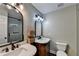 Tasteful bathroom features double vanities, modern fixtures, and frameless glass shower at 975 Timber Lake Trl, Cumming, GA 30041