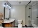 Modern bathroom features a sleek glass shower, updated lighting, and stylish tile at 975 Timber Lake Trl, Cumming, GA 30041