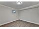 Bedroom with hardwood floors, natural light, and neutral colors at 975 Timber Lake Trl, Cumming, GA 30041
