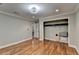 Spacious bedroom featuring hardwood floors and a large closet at 975 Timber Lake Trl, Cumming, GA 30041