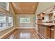 Dining room features wood flooring and a wood ceiling at 975 Timber Lake Trl, Cumming, GA 30041