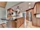Gourmet kitchen featuring a center island with granite countertop and stainless steel appliances at 975 Timber Lake Trl, Cumming, GA 30041