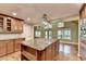 Gourmet kitchen featuring a center island with granite countertop and stainless steel appliances at 975 Timber Lake Trl, Cumming, GA 30041