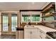 The kitchen has wood countertops and a stainless steel dishwasher next to the window at 975 Timber Lake Trl, Cumming, GA 30041